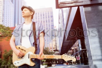 Similar – outdoor photo session with a bass player and his instruments