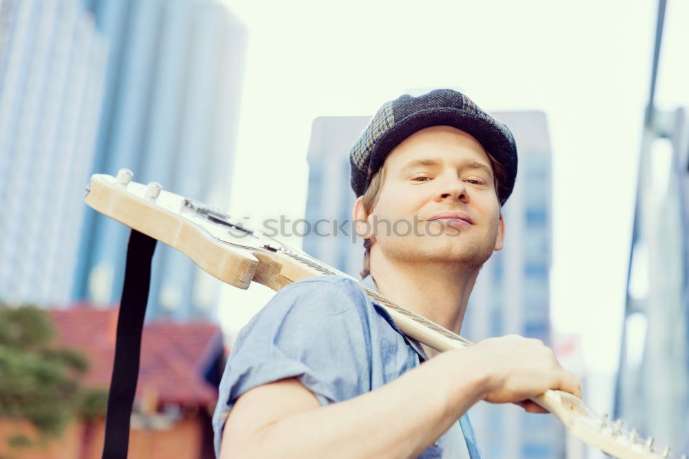 Similar – outdoor photo session with a bass player and his instruments