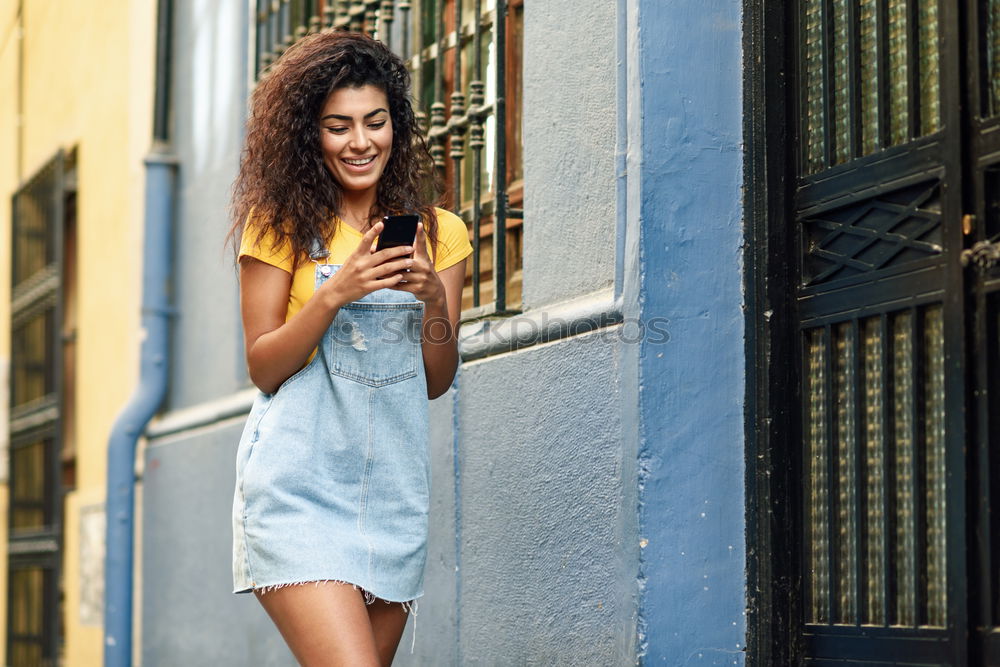 Similar – Image, Stock Photo African woman walking on the street looking at her smart phone