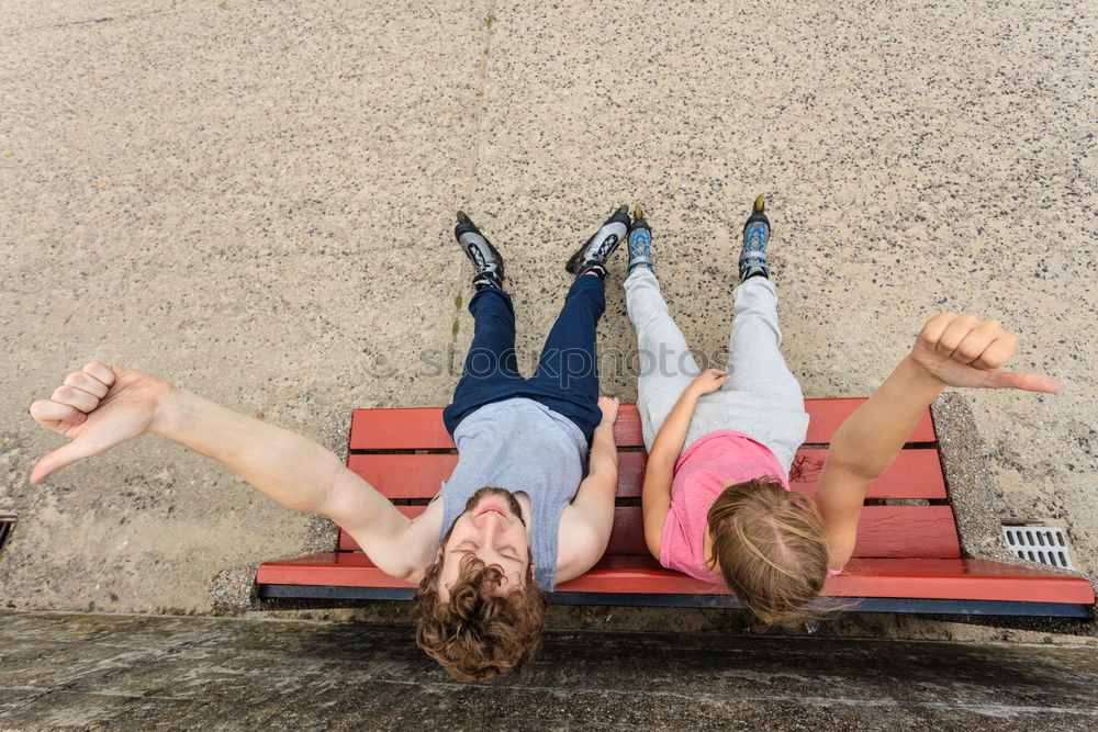 Happy friends sitting on steps