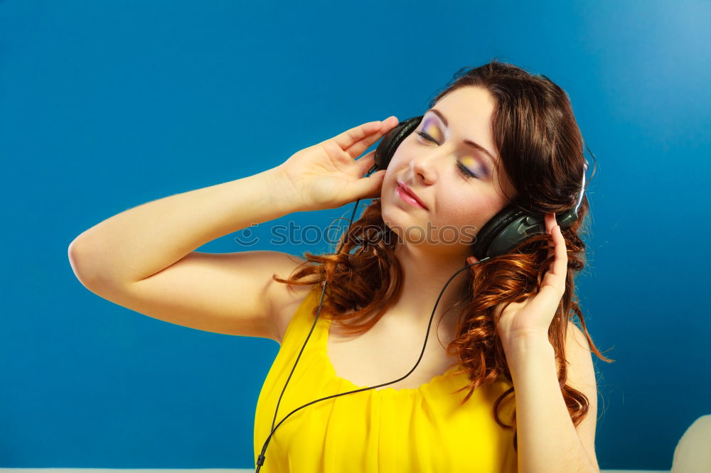 Similar – Cheerful woman in yellow jacket