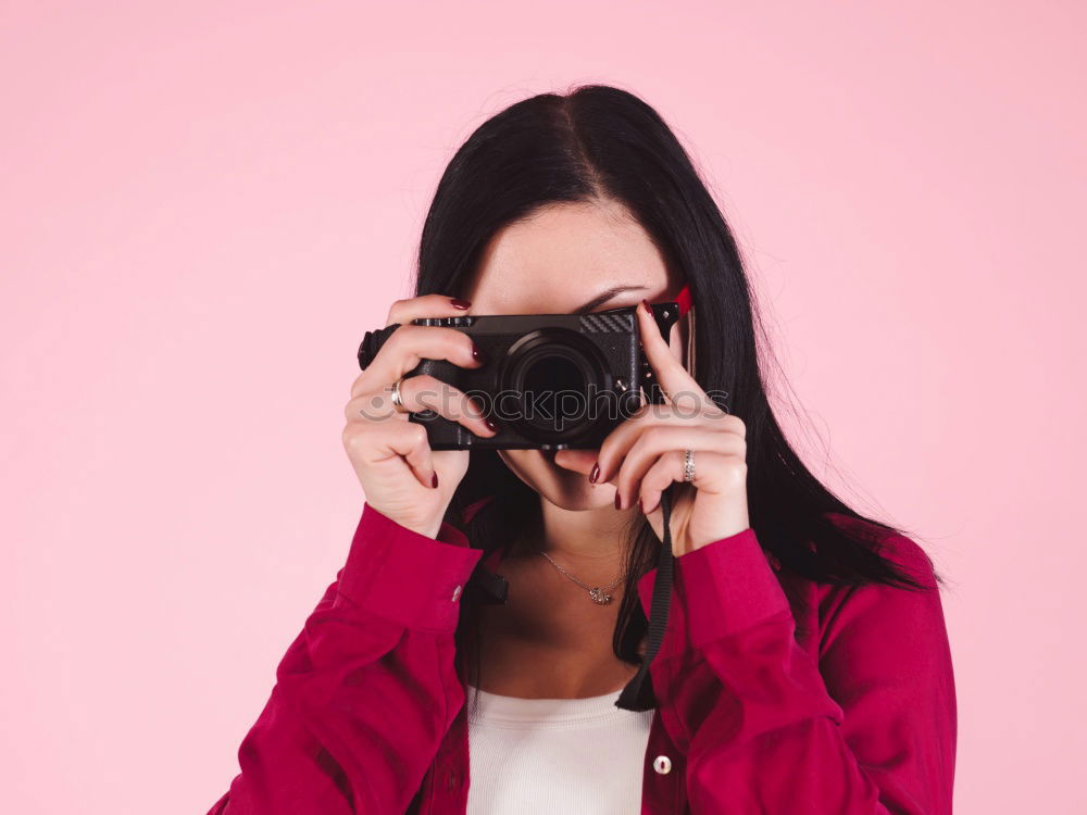 Similar – close up portrait of a young woman holding a camera. Photography concept