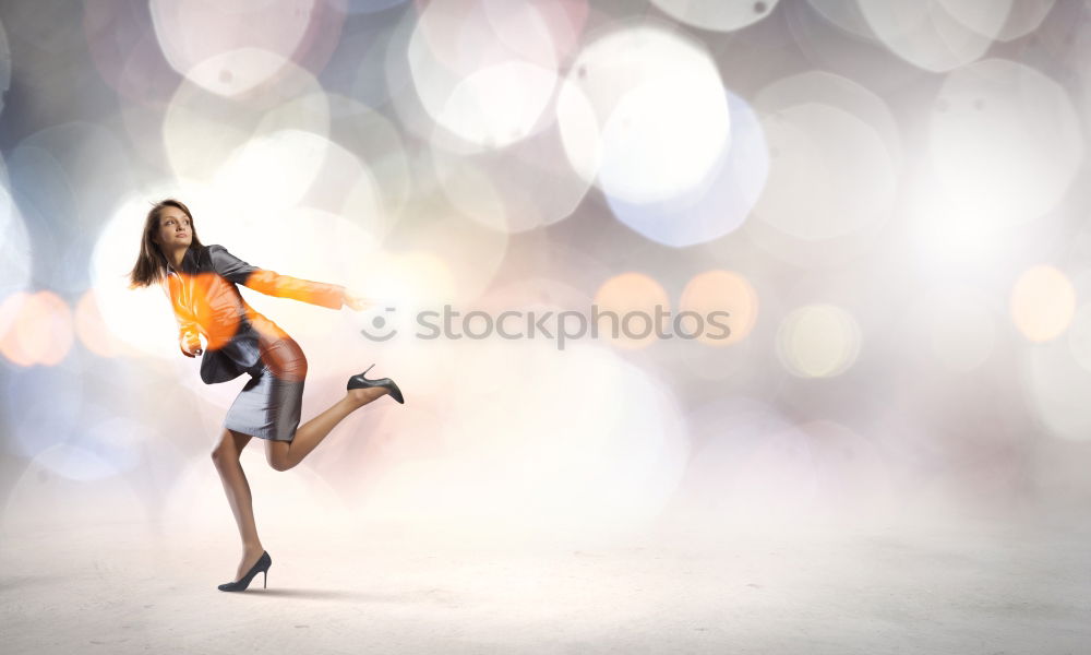 Similar – Young woman sitting on the street