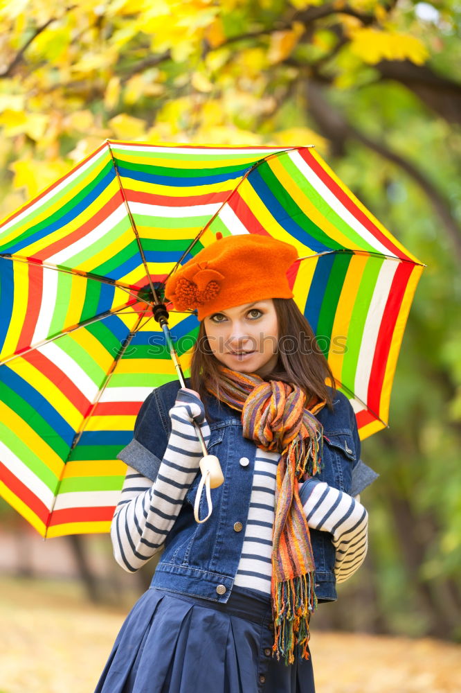 Similar – happy kid girl hiding under umbrella