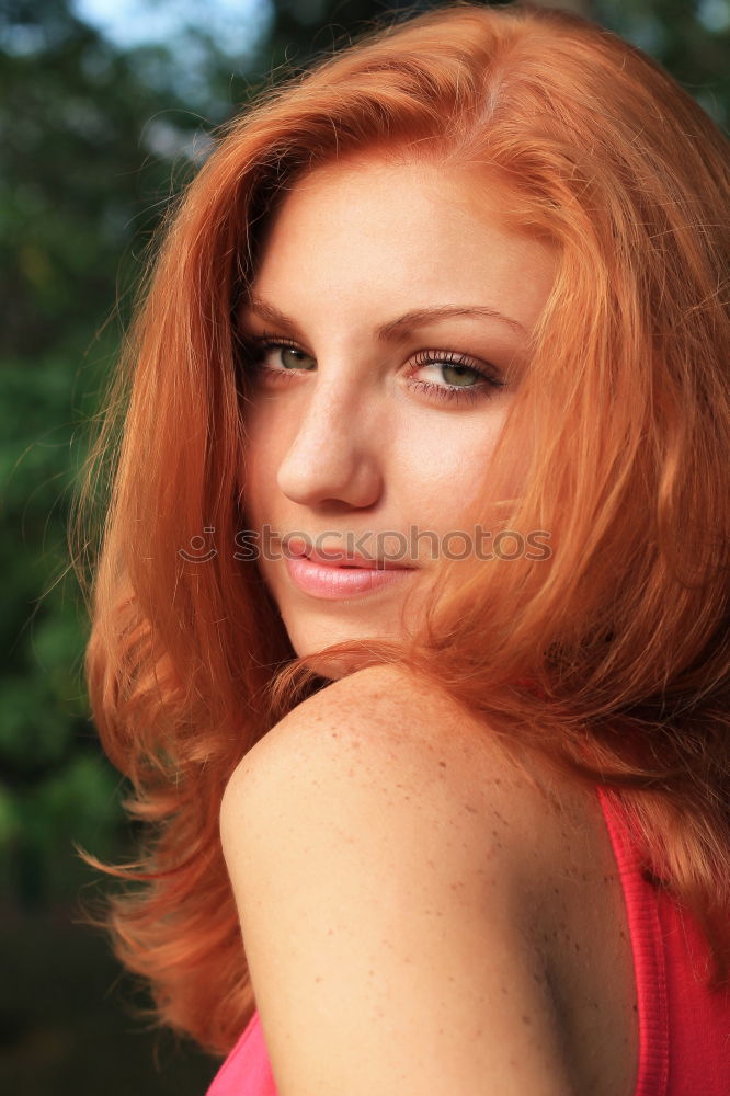 Similar – young woman with bright eyes, red hair and gap teeth smiles