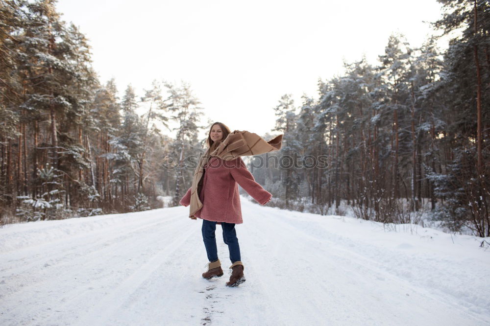 Similar – happy child girl walking country road with her dog