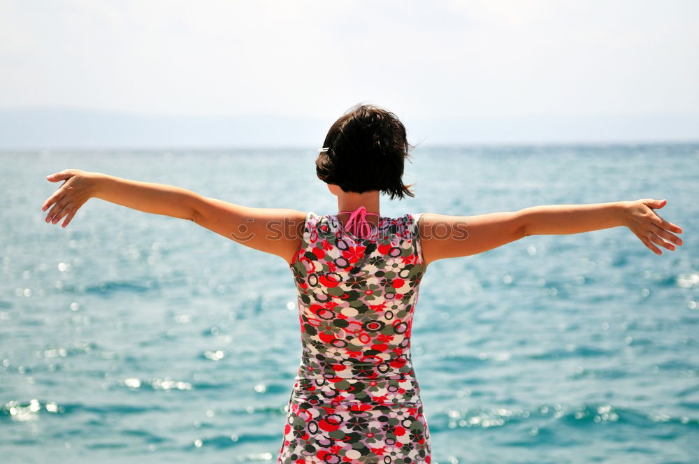 Similar – Image, Stock Photo woman with long pink dress on a tropical beach