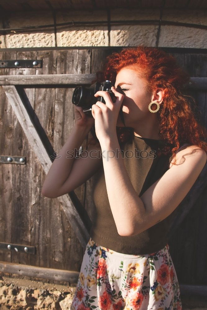 Similar – Young redhead photographer woman