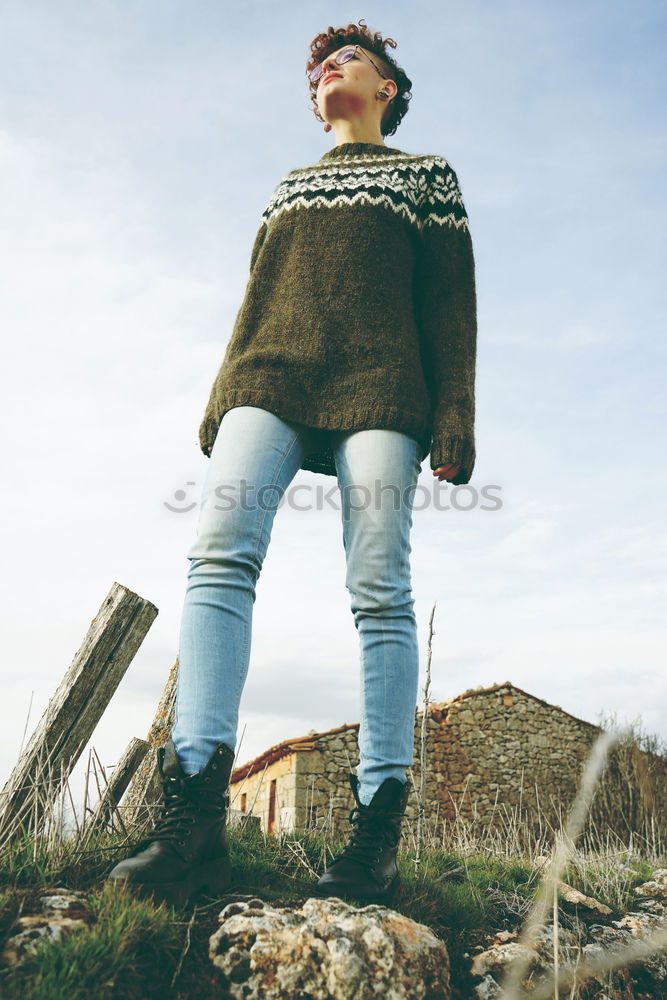 Similar – Young redhead woman walking along an old wall