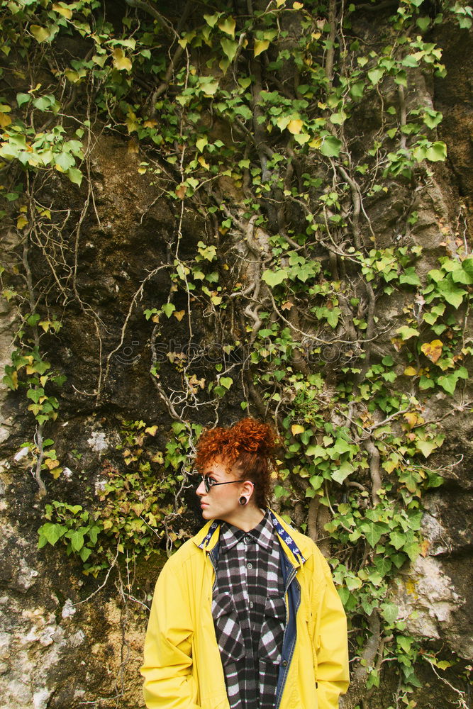 Young redhead woman outdoors in nature