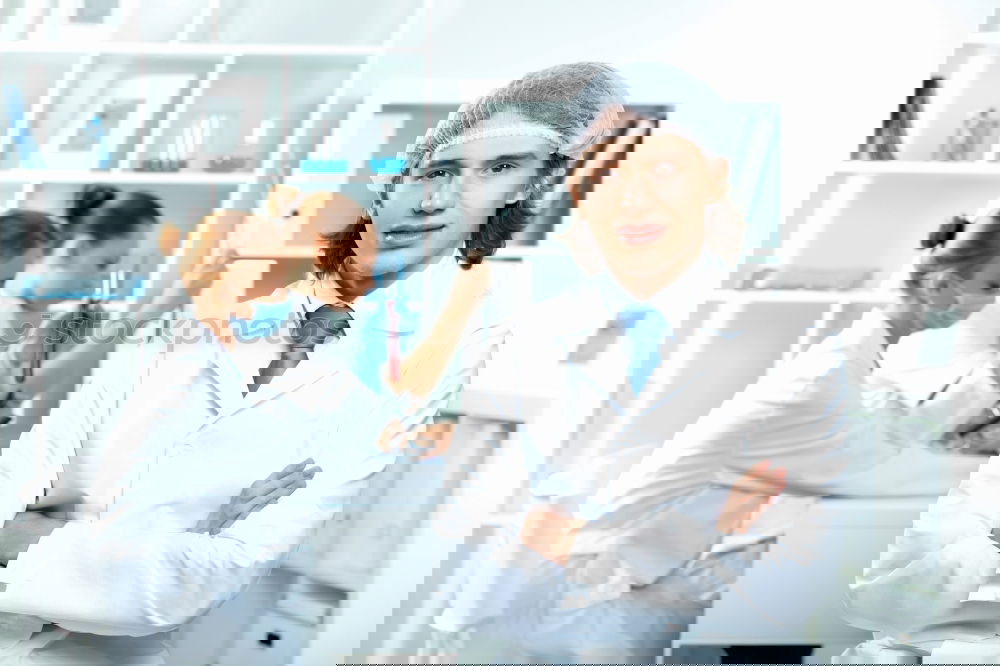 Similar – Image, Stock Photo People co-working in lab