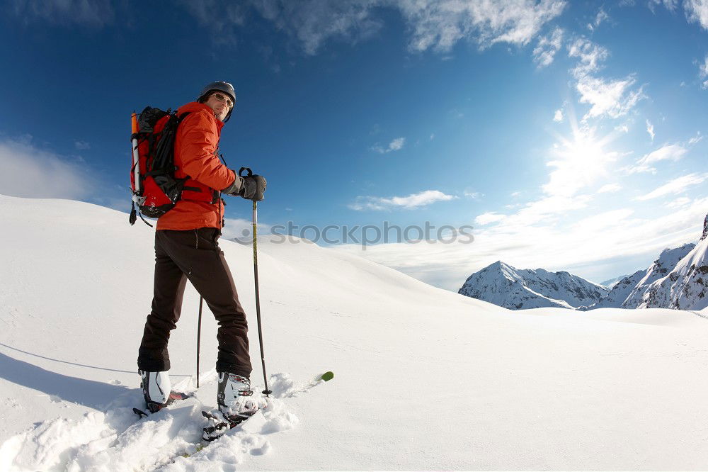 Similar – Image, Stock Photo Mountaineer faces a climb at the top of a snowy peak.