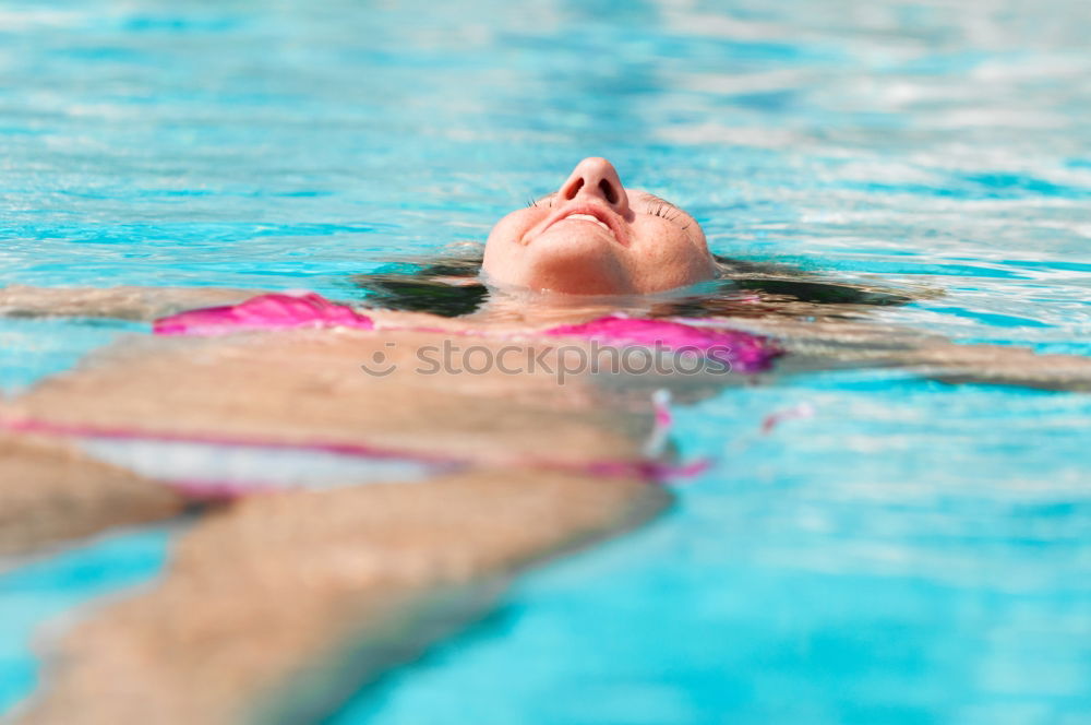 Similar – Unterwasseraufnahme. Körper  einer schlanken  jungen Frau Im Badeanzug  im Schwimmbecken