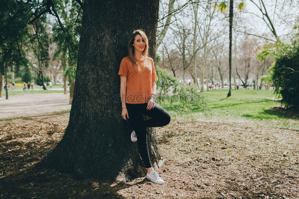 Similar – Woman enjoys sun on park bench