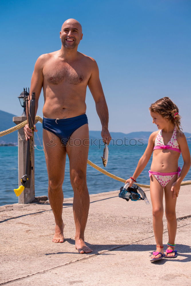 Similar – Grandpa and grandson smiling on a swimming pool side