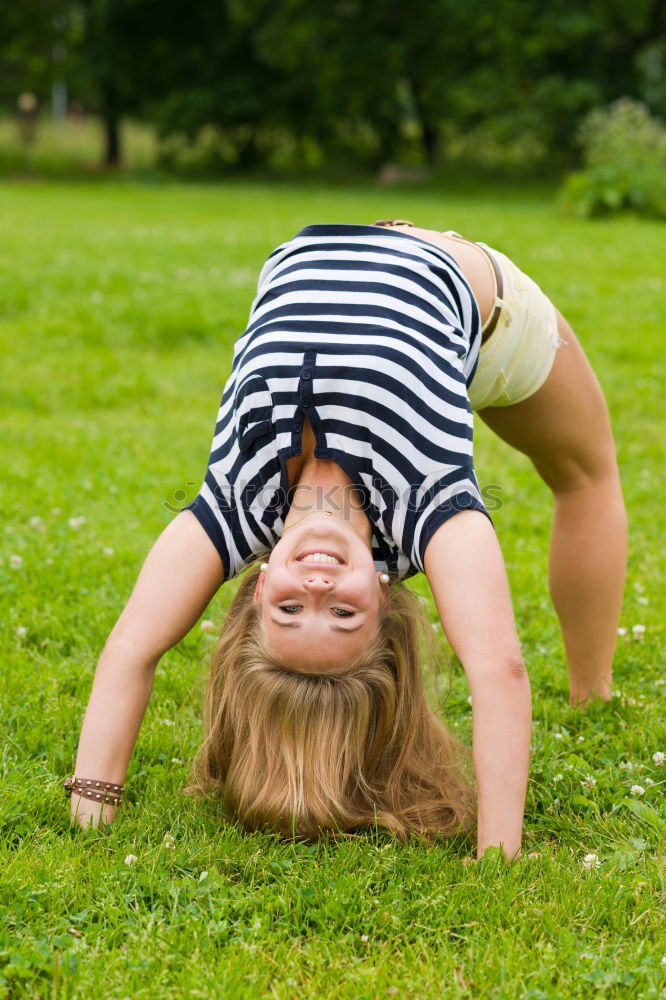 Similar – Image, Stock Photo Girls doing gymnastics and biking in the park ll