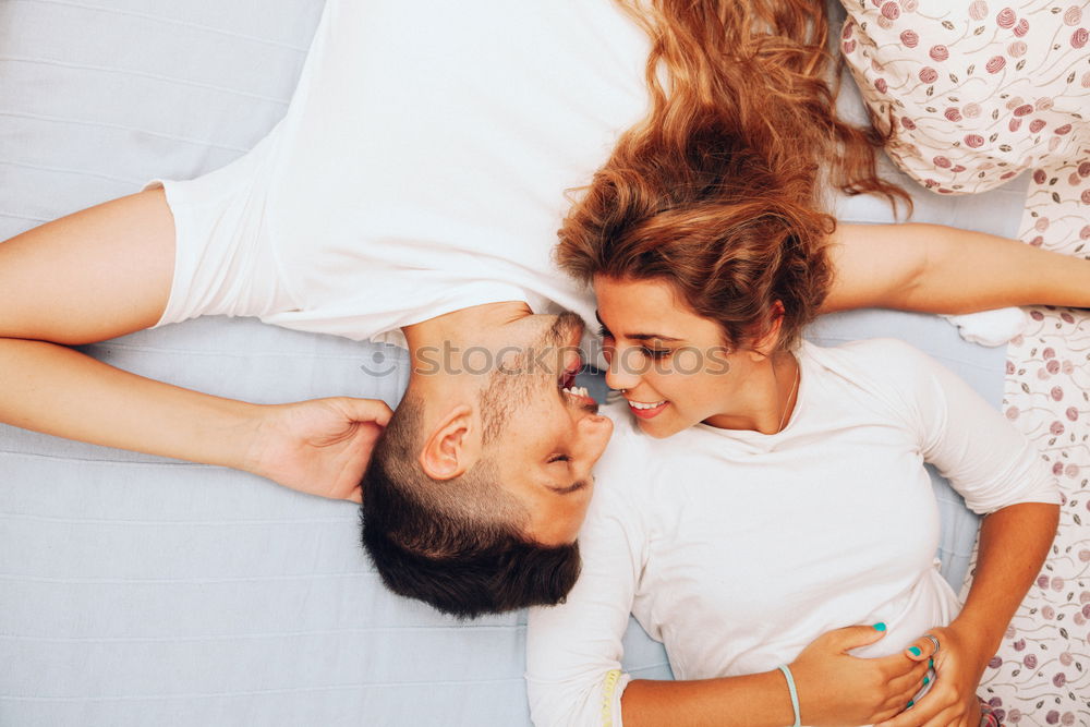 Similar – Boyfriend giving his girlfriend a kiss in the bed