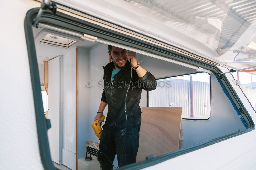 Similar – Image, Stock Photo Man in respirator measuring surf board in workshop