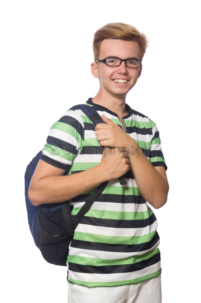 Young urban man using smartphone walking in street in an urban park