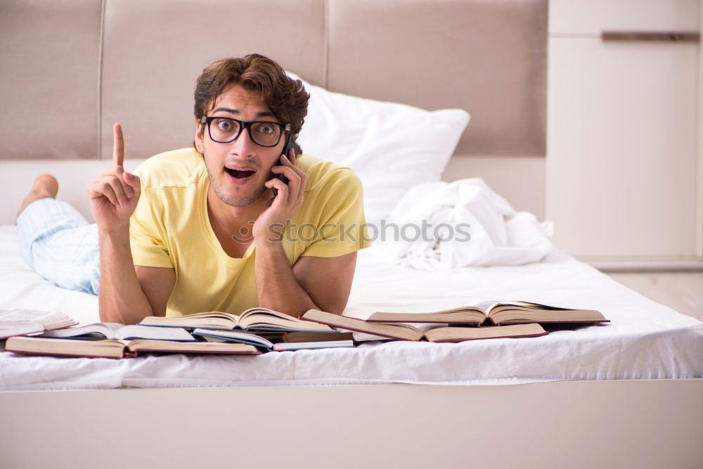 Similar – Image, Stock Photo Young couple reading book on couch at home