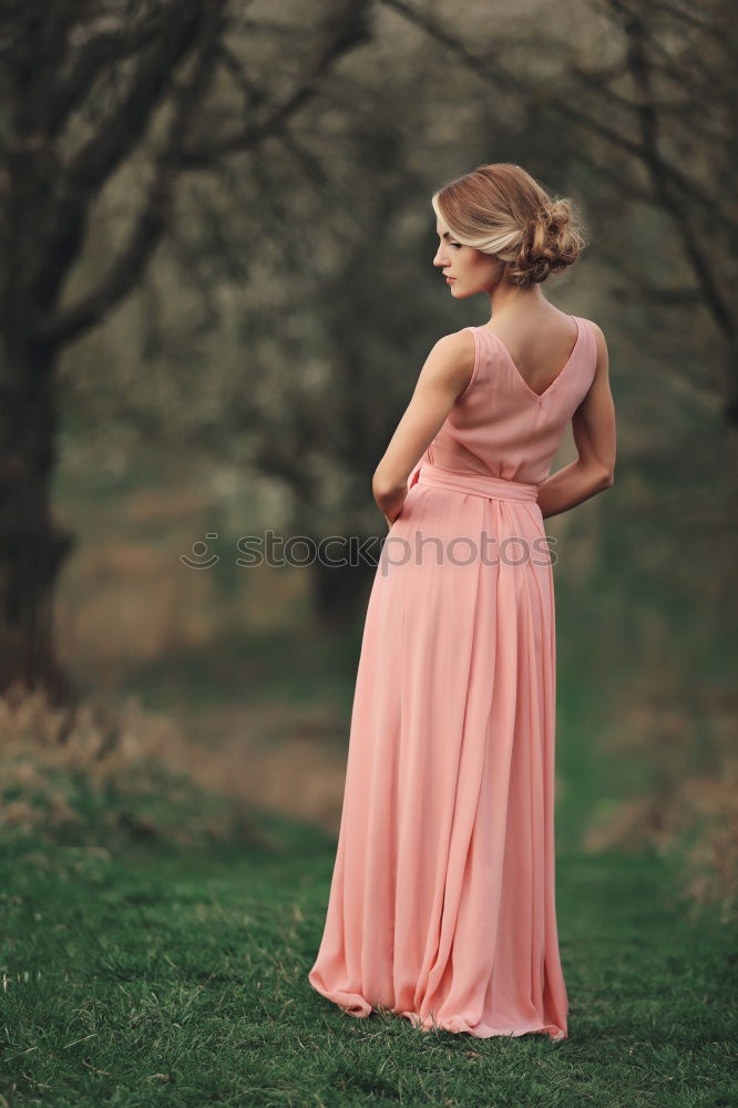 Similar – Young woman in almond flowered field in spring time