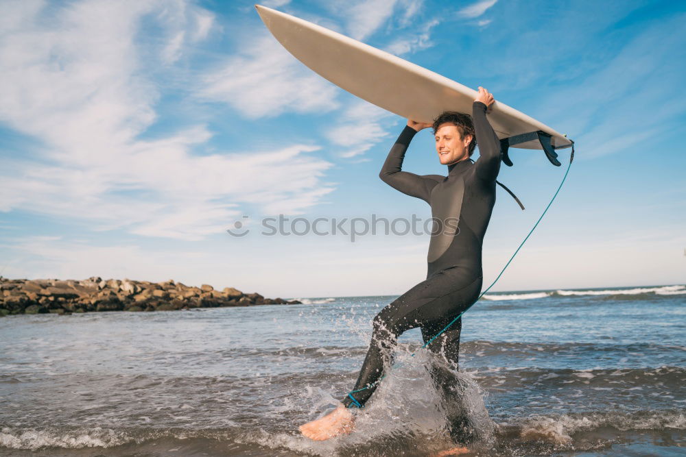 Similar – A young boy learning in body board outdoors in the shoreline in a sunny day of summer