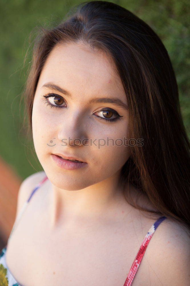 Similar – Portrait of a young teenager girl standing looking throughout the window