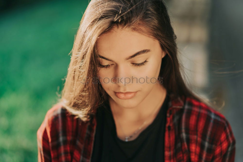 Similar – sad young woman sitting on bench