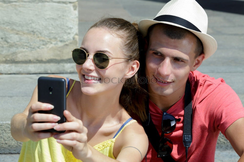 Similar – Cheerful friends taking photos of themselves on smart phone