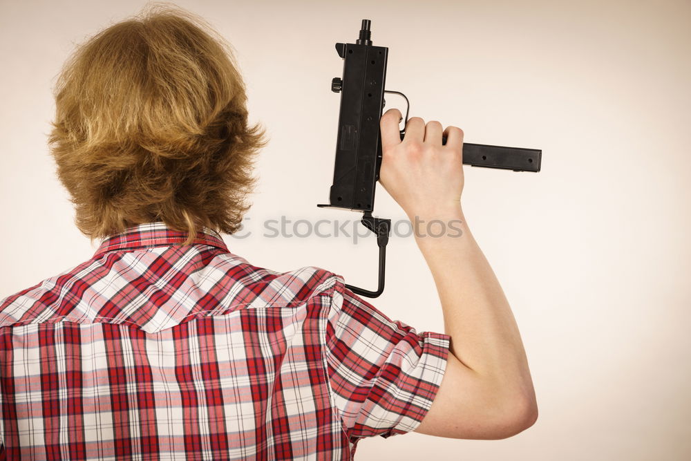 Image, Stock Photo Young photographer playing with accessories for professional camera like with rifle while lying on floor