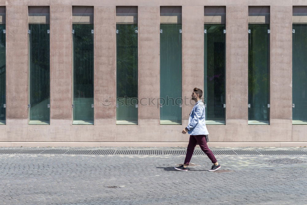 Similar – Foto Bild Jugendliche mit Rastas hockt ganz allein lässig am Straßenrand vor dem Denkmal von Karl Marx