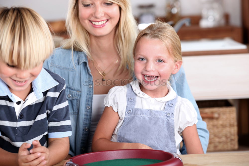 Similar – Family decorating baked Christmas gingerbread cookies with frosting