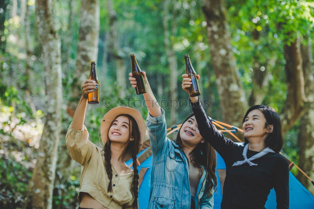 Similar – Gruppe Freunde, die mit Wunderkerzen nachts auf Felsen feiern