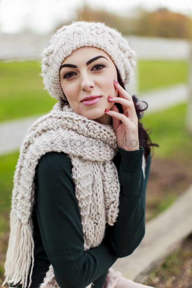 Similar – Young woman sitting on the street