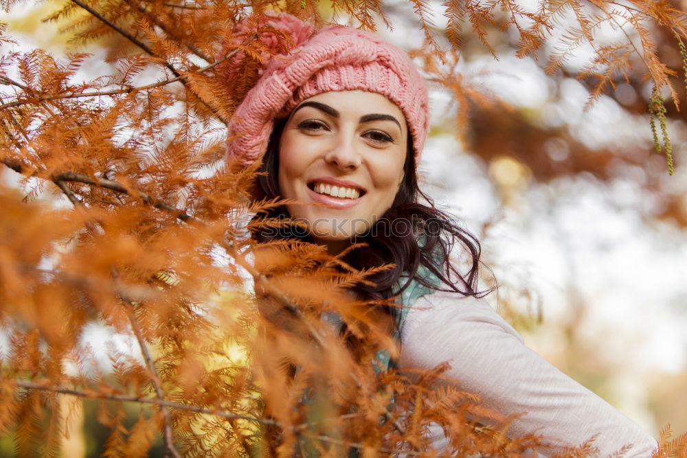 Similar – Matured woman with pink wool hat in the forest