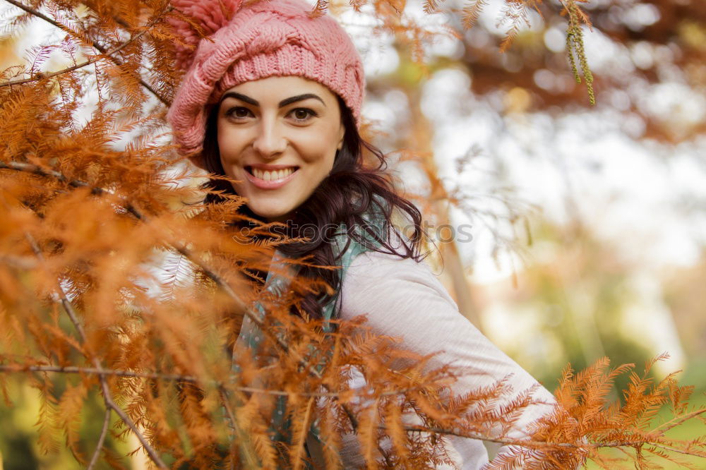 Similar – Matured woman with pink wool hat in the forest