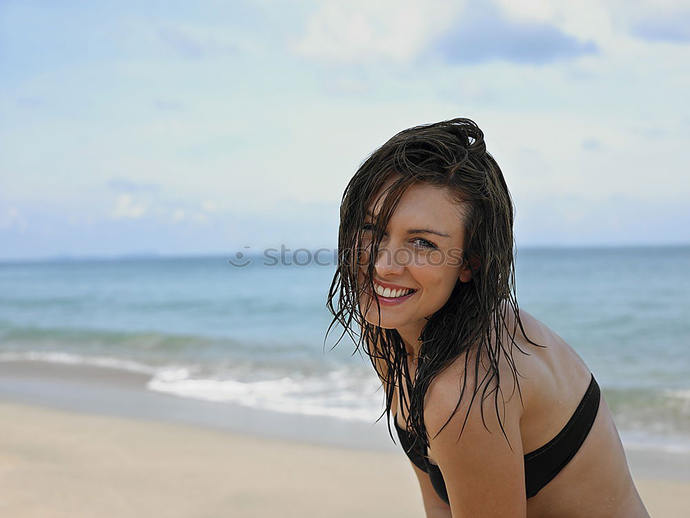 Similar – Beautiful young woman in sexy bikini standing at sea beach. Beautiful woman in violet bikini on tropical beach. Portrait of brunette tanned girl in swimwear