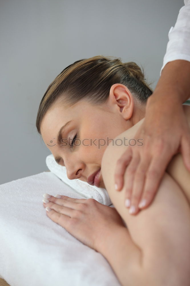 Similar – Image, Stock Photo Woman receiving back massage on clinical center