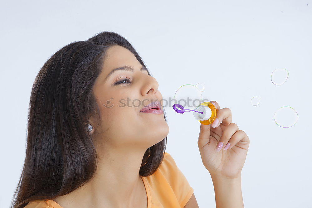 Similar – Image, Stock Photo Young caucasian women blowing bubbles