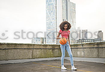 Similar – Porträt einer jungen Basketballspielerin. Schöne Teenager-Mädchen spielen Basketball. in Sportkleidung Basketball spielen