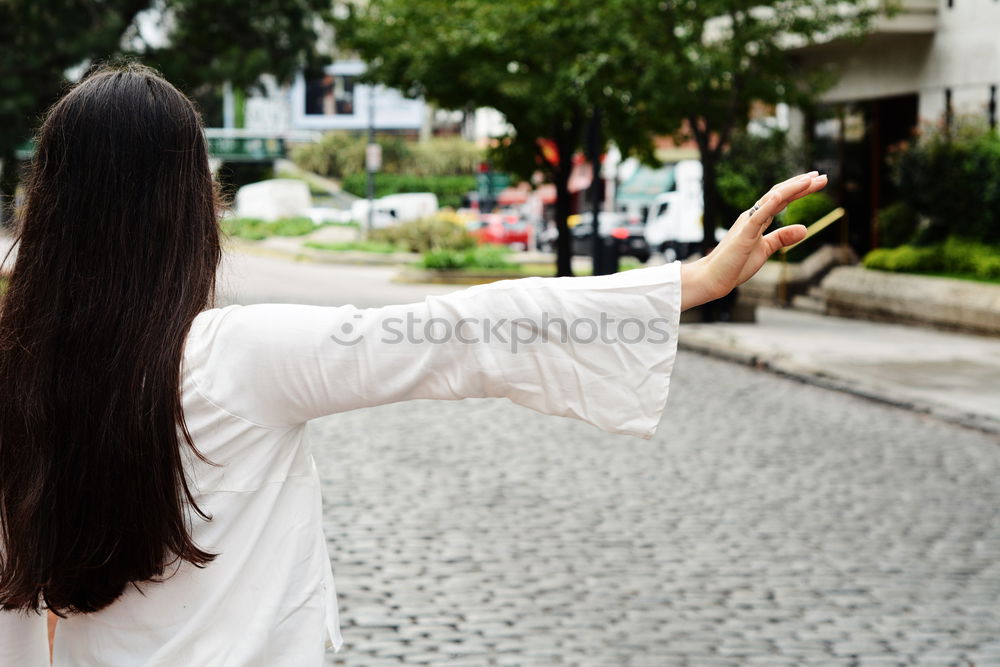 Similar – Image, Stock Photo Cheerful traveler posing at street