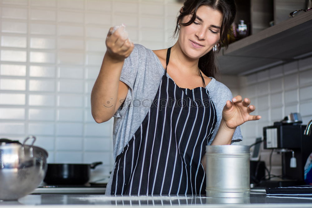 Similar – Young couple cooking. Man and woman in their kitchen