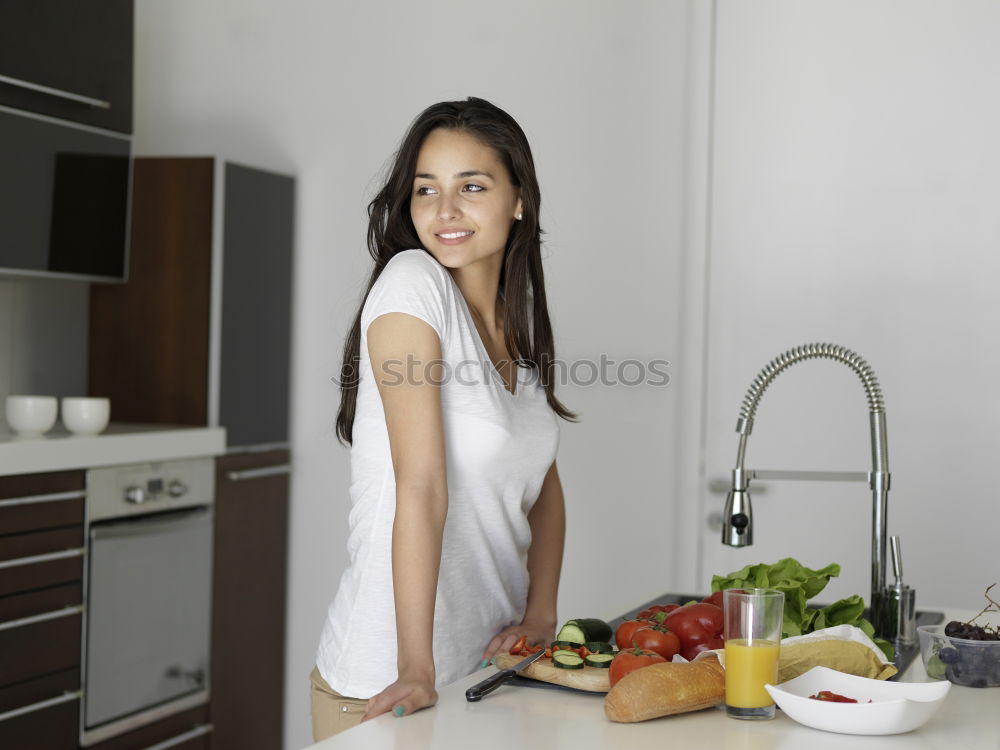 Similar – Image, Stock Photo Happy contented housewife in her kitchen