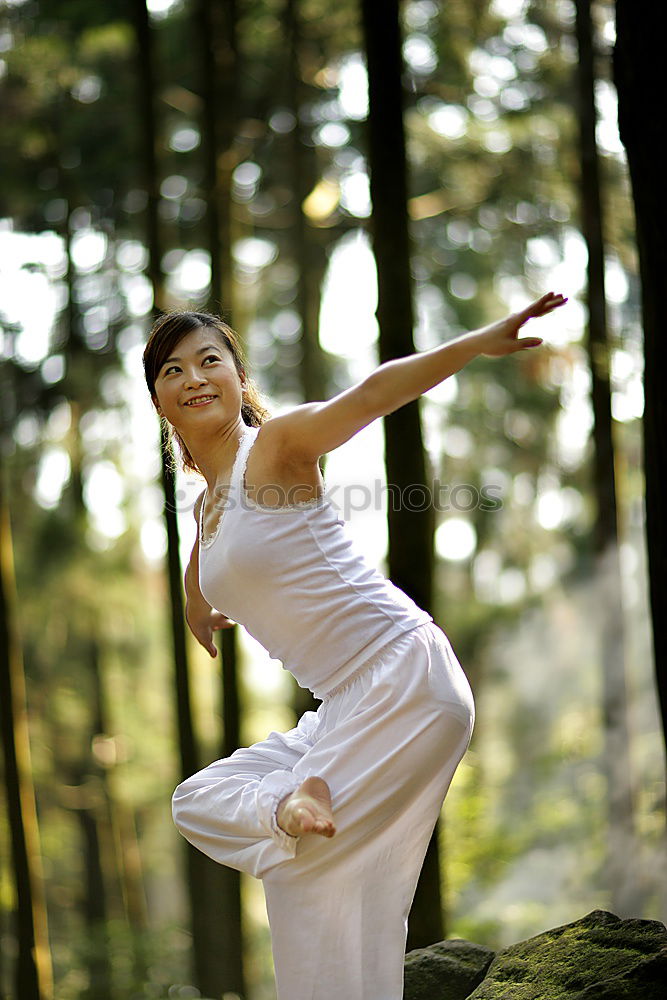 Similar – Image, Stock Photo Young woman doing yoga in nature.