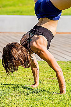 Similar – Schlanke Frau macht Handstand beim Training