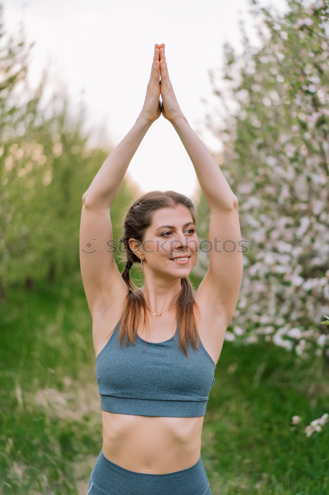 Similar – Young woman meditates in yoga asana Padmasana