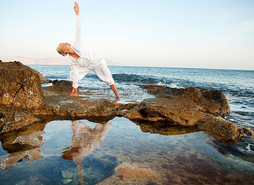 Similar – Image, Stock Photo Fit African woman doing yoga exercise on rocks by the beach