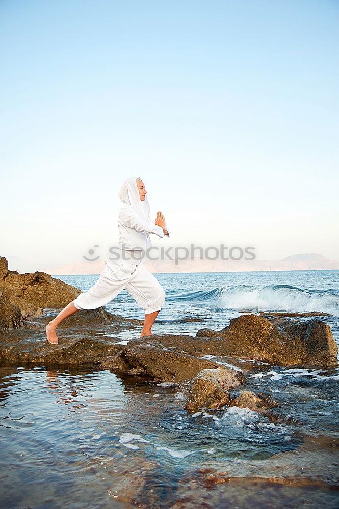 Similar – Diver in shallow water preparing to swim