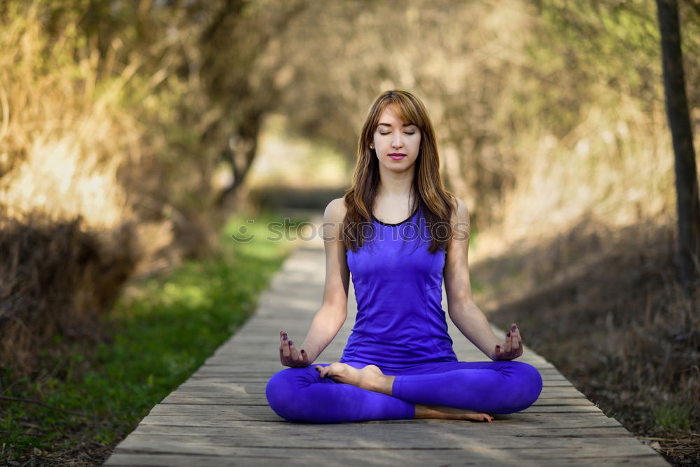 Similar – Image, Stock Photo Young woman doing yoga on wooden road in nature