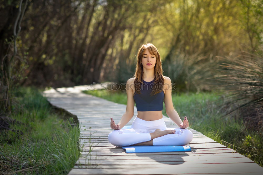 Similar – Image, Stock Photo Woman doing yoga in nature. Lotus figure on wooden bridge.